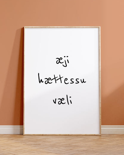 Veggspjald í ramma upp við brúnappelsínugulan vegg með textanum: æji hættessu væli